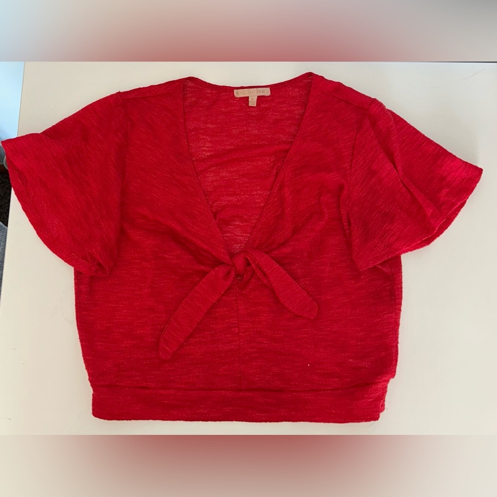 Slightly cropped red shirt